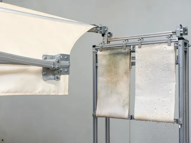 Awning fabric with tension and weathering specimen