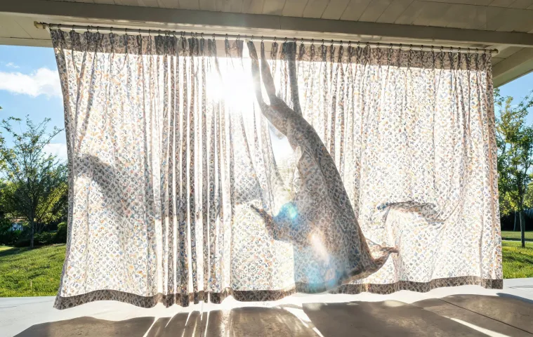 Outdoor curtain under wind and sunlight